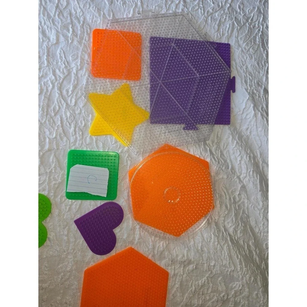 Lot C Perler bead pegboards in various shapes and bright colors